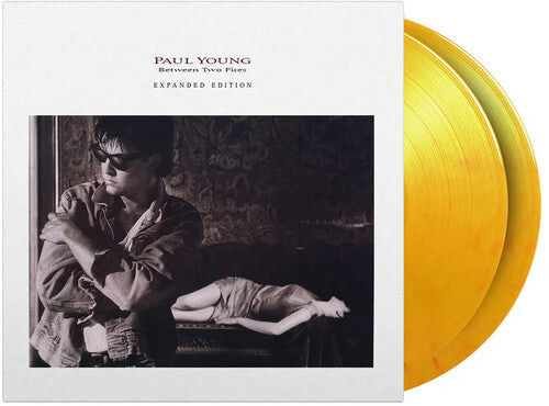 Paul Young: Between Two Fires - Limited & Expanded 180-Gram Flame Colored Vinyl { Vinyl LP }
